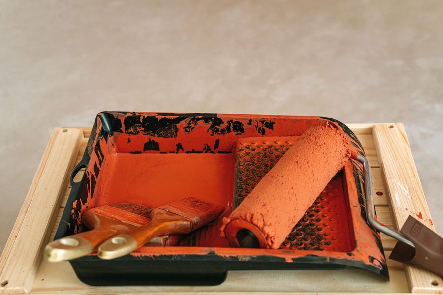 Paint roller and brushes in a tray